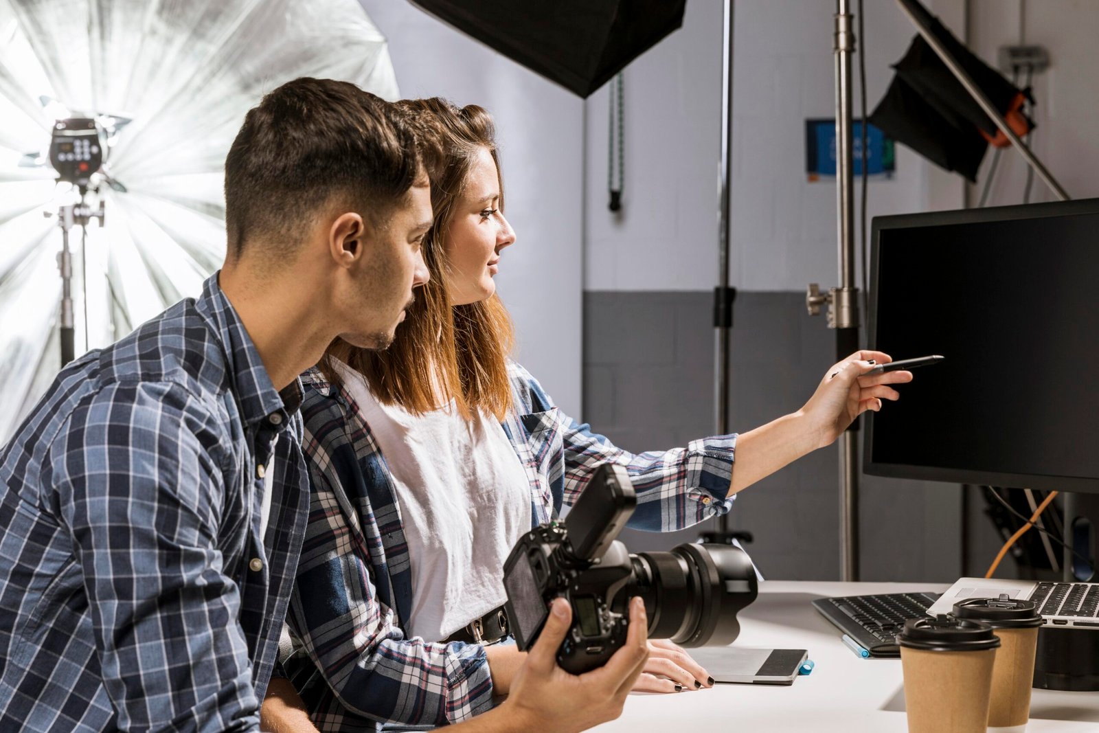Video crew setting up lighting at a Spokane business